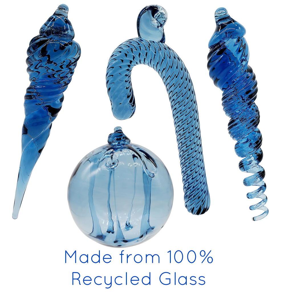 Recycled glass ornaments each individually handblown here in our studio. Recycled glass as we prepare it, always has a hue of blue that changes from batch to batch, and top of the tank to bottom. 